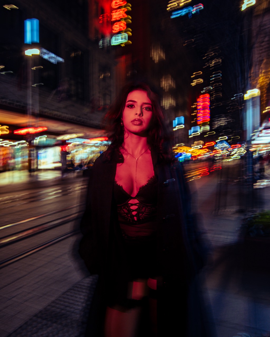 Motion-blur city portrait with neon lights
